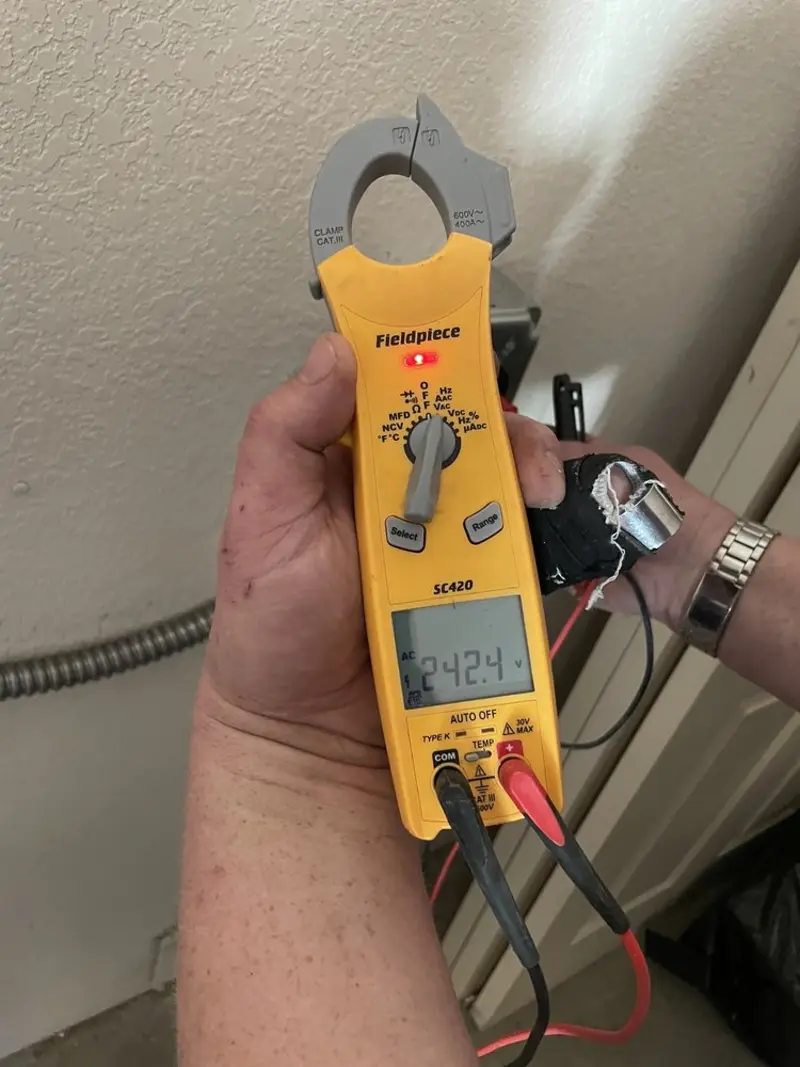 Voltage testing with clamp meter during Recessed Lighting Installation in South Fulton